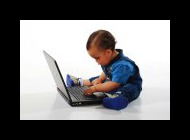 Toddler working at a laptop