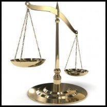 A brass balance scale, tipped.